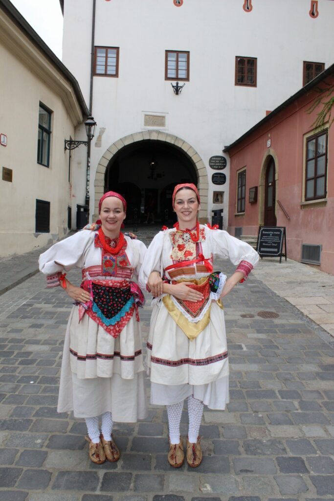 2 Prigorje ladies standing in front of Kamenita vrata - Stone gate
