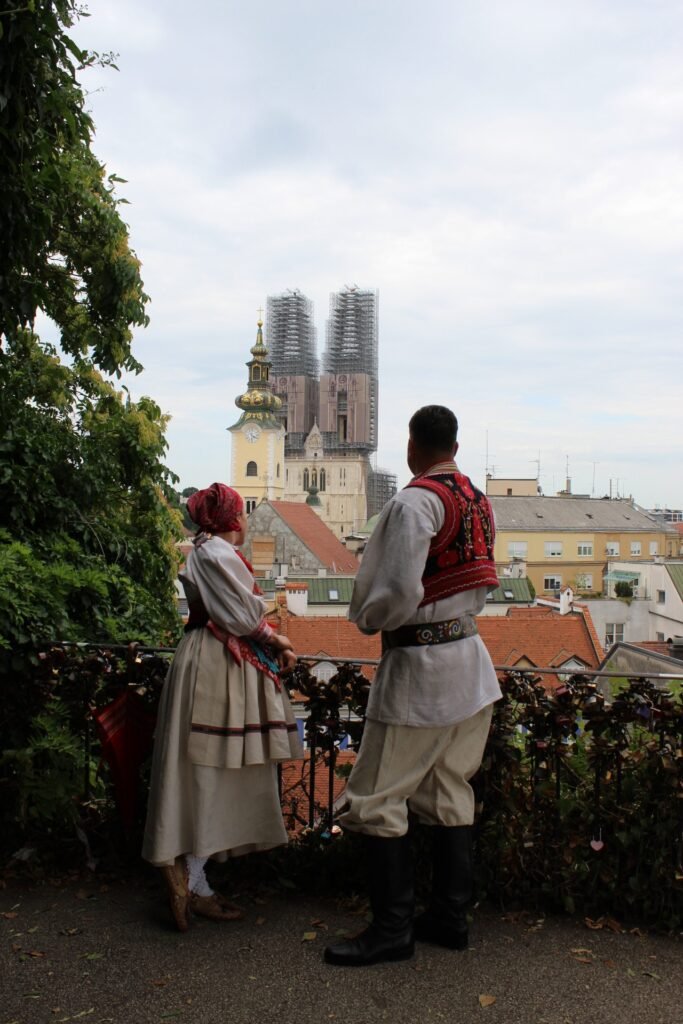 A couple looking at Zagreb Cathedral